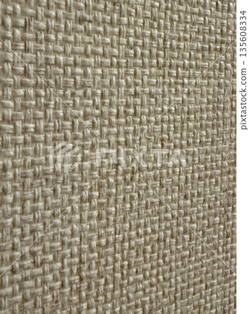 Closeup of burlap fabric texture showcasing natural woven pattern for organic background Closeup of burlap fabric texture showcasing natural woven pattern for organic background 135608334