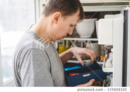 Adult man looking for tools 135608385