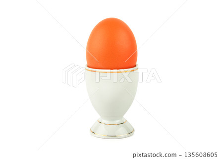 Brown Boiled Egg in White Porcelain Stand Isolated on White Brown Boiled Egg in White Porcelain Stand Isolated on White 135608605