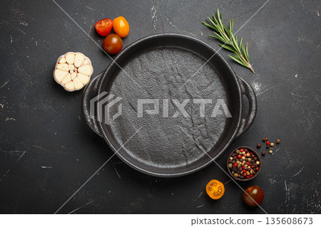 Cast black empty iron cooking pan fresh ingredients cooking healthy copy space 135608673