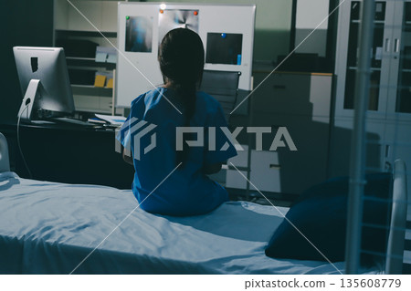 A patient with depression looks outside. 135608779