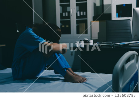 A patient with depression looks outside. A patient with depression looks outside. 135608783
