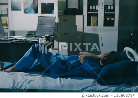 A patient with depression looks outside. A patient with depression looks outside. 135608784