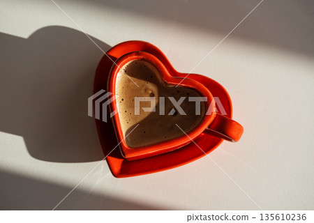 Heart Shaped Red Coffee Cup on White Background. Romantic Still Life for Valentines Day 135610236