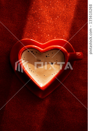 Heart-Shaped Red Coffee Cup on Glitter Background. Romantic Still Life for Valentines Day 135610268