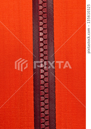 Close up of color zip on sport jacket , macro shot 135610325