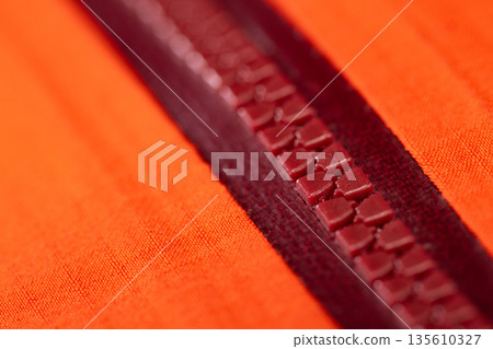 Close up of color zip on sport jacket , macro shot 135610327