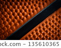 Macro close-up basketball ball with knurling and black line 135610365