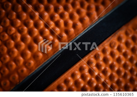 Macro close-up basketball ball with knurling and black line Macro close-up basketball ball with knurling and black line 135610365
