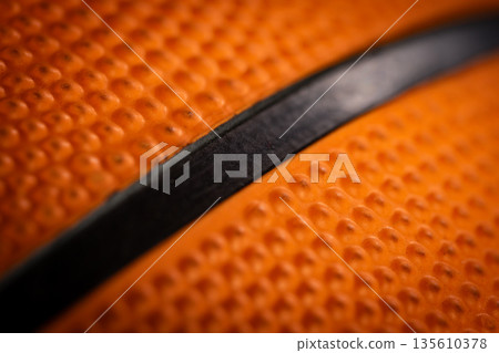 Macro close-up basketball ball with knurling and black line 135610378