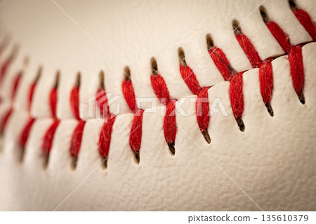 Macro close-up baseball ball with stiches and seam 135610379