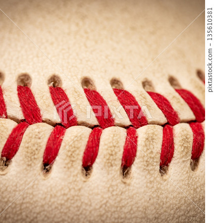 Macro close-up baseball ball with stiches and seam 135610381