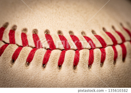 Macro close-up baseball ball with stiches and seam 135610382
