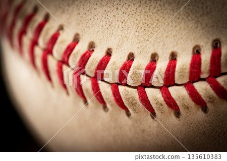 Macro close-up baseball ball with stiches and seam 135610383