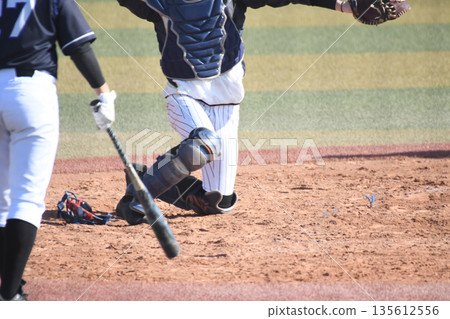 Catcher throwing the ball to the pitcher Catcher throwing the ball to the pitcher 135612556