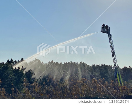 Water spraying training using fire engines Water spraying training using fire engines 135612974