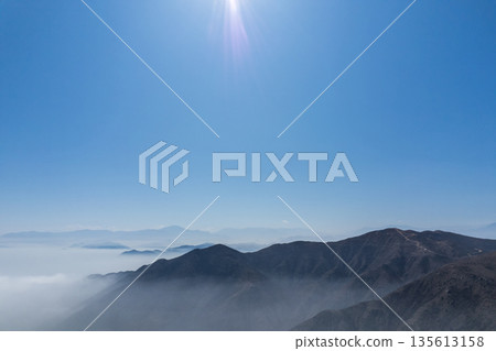 The sky is blue and the sun is shining brightly The sky is blue and the sun is shining brightly 135613158