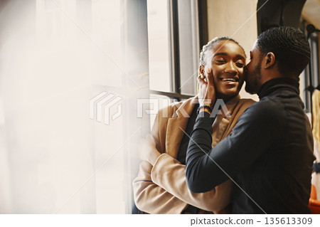 Two young people in cafe. African couple enjoying the time spending with each other. Two young people in cafe. African couple enjoying the time spending with each other. 135613309