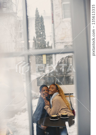 Two young people in cafe. African couple enjoying the time spending with each other. 135613335