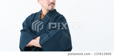 A man wearing a kimono A man wearing a kimono 135613609