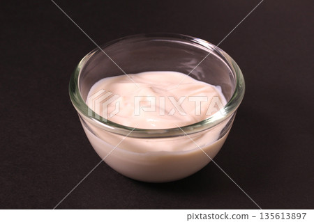 Soy yogurt in a glass bowl (black background) 135613897