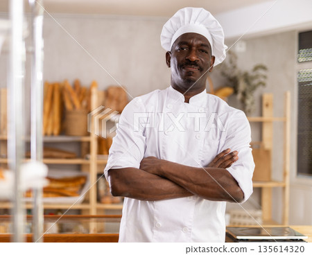 Portrait of positive man baker Portrait of positive man baker 135614320