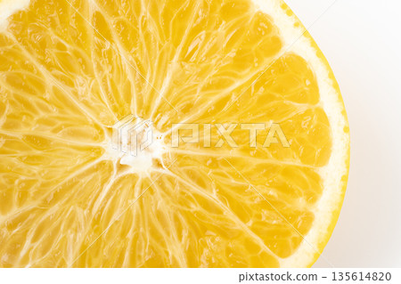 A close-up of the cross section of a sliced hassaku orange 135614820