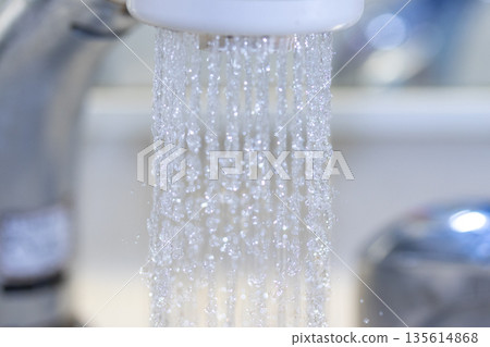 Water flowing from the shower head Water flowing from the shower head 135614868