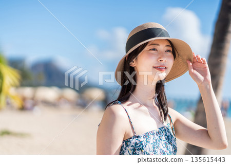 Young woman enjoying vacation. 135615443