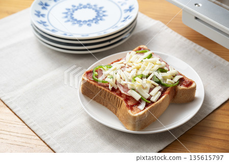 Baking pizza toast in a toaster oven Before baking 135615797