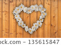White Flowers Heart on Natural Wood Plank Surface. Top View Photo. Valentines Day and Love Wallpaper Background. File with Clipping Path. 135615847