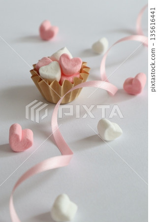 Cute heart-shaped marshmallows and ribbon 135616441