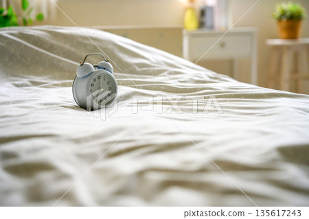 Alarm Clock on Bed Alarm Clock on Bed 135617243