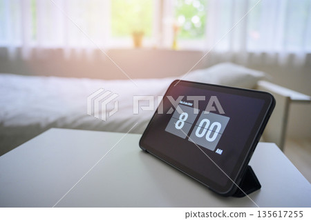 8 AM displayed on a tablet 8 AM displayed on a tablet 135617255