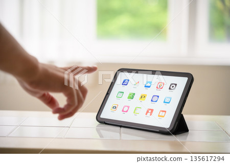 Tablet operation and fingertips 135617294