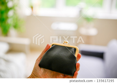 Holding a clasp pouch Holding a clasp pouch 135617295