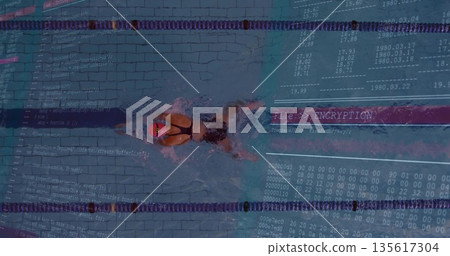 Swimmer wearing pink swim cap slicing between lane dividers in pool with encryption overlay Swimmer wearing pink swim cap slicing between lane dividers in pool with encryption overlay 135617304