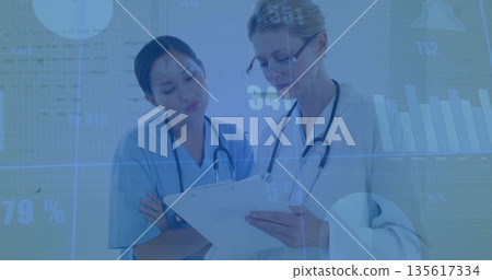 Nurse and doctor examining chart data overlays in corridor with clipboard, stethoscopes, eyeglasses 135617334