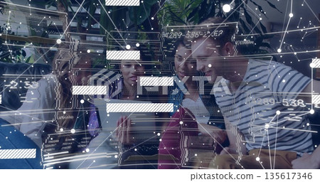 Collaborating team of four professionals analyzing tablet data in coworking lounge, with overlays 135617346