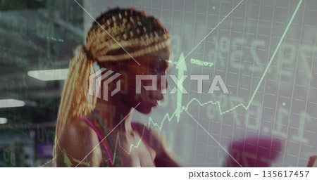 Gripping cardio machine handles, woman wearing pink sports bra training in gym, with chart overlay Gripping cardio machine handles, woman wearing pink sports bra training in gym, with chart overlay 135617457
