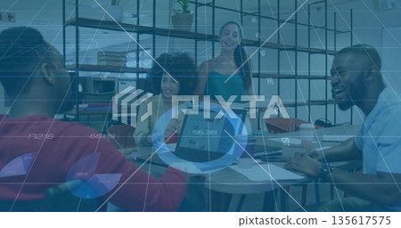 Four business professionals discussing data in office area, with two laptops and printed charts 135617575