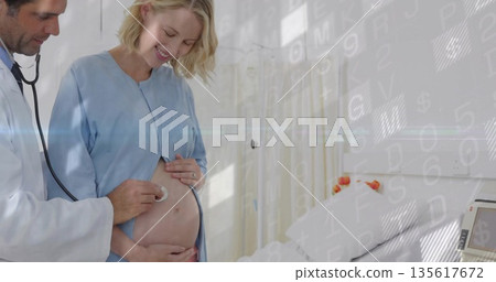 Listening provider using stethoscope on pregnant abdomen in exam room, with bed, gown and curtains 135617672