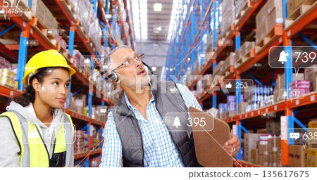 Warehouse staff wearing hard hats and vests scanning boxes in aisle, with clipboard and icons 135617675