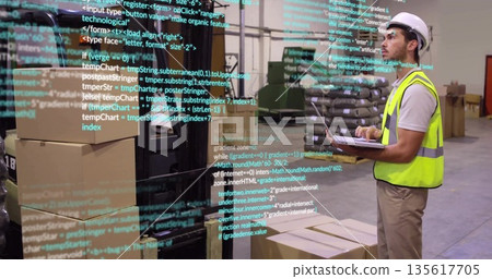 Worker in safety vest scanning on laptop at warehouse with boxes, code overlay, copy space 135617705
