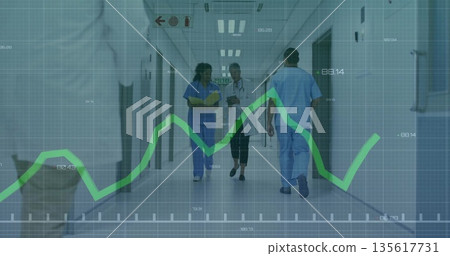 Walking medical team reviewing data in corridor with yellow folder tablet stethoscope graph overlay Walking medical team reviewing data in corridor with yellow folder tablet stethoscope graph overlay 135617731