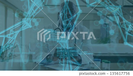 Doctor wearing white lab coat tapping smartphone screen in medical office, with DNA helix graphic Doctor wearing white lab coat tapping smartphone screen in medical office, with DNA helix graphic 135617756
