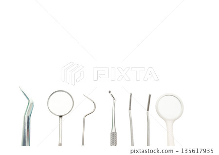Set of dental tools arranged on a clean white surface, isolated, PNG Set of dental tools arranged on a clean white surface, isolated, PNG 135617935