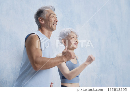Senior men and women jogging 135618295