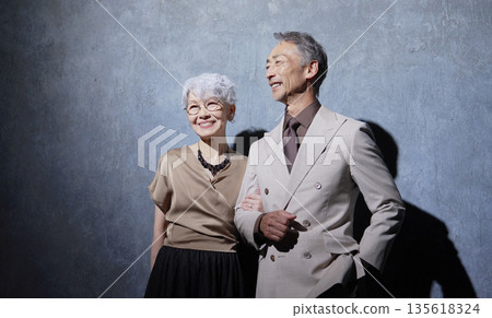 Portrait of a friendly senior couple on a black background 135618324