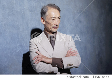 Portrait of a senior man in a suit on a black background 135618333